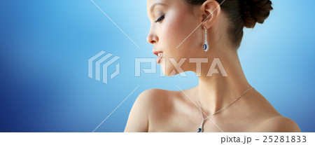 beautiful asian woman with earring and pendant beautiful asian woman with earring and pendant 25281833