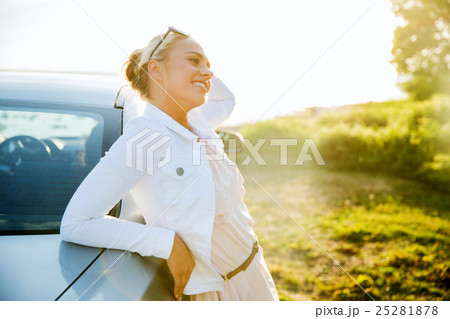 happy teenage girl or young woman near car happy teenage girl or young woman near car 25281878