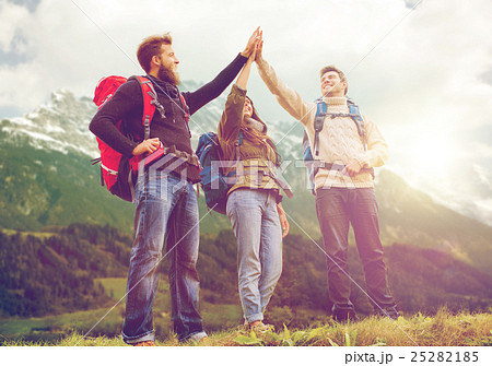 group of smiling friends with backpacks hiking group of smiling friends with backpacks hiking 25282185