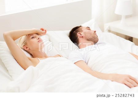 couple sleeping in bed at home couple sleeping in bed at home 25282743