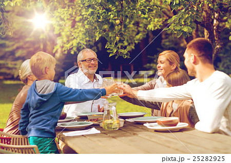 happy family having holiday dinner outdoors happy family having holiday dinner outdoors 25282925