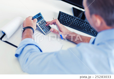 businessman with notebook and calculator businessman with notebook and calculator 25283033