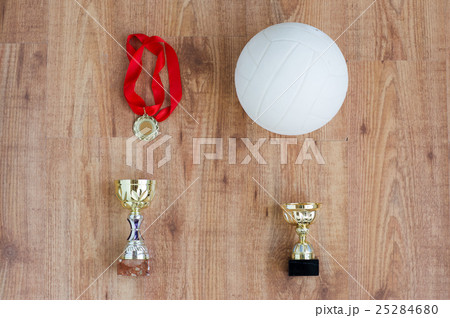 close up of volleyball ball, cups and medals close up of volleyball ball, cups and medals 25284680