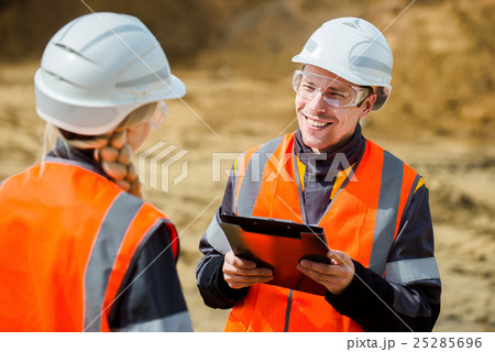 Two people working 25285696