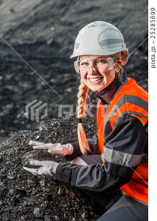 Worker with coal in the hands Worker with coal in the hands 25285699