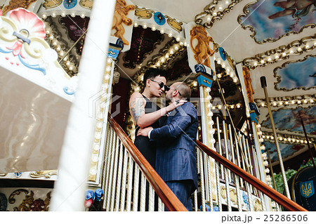 adult man and woman on a carousel adult man and woman on a carousel 25286506