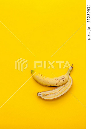 Peel banana and fruit on a yellow background Peel banana and fruit on a yellow background 25289934