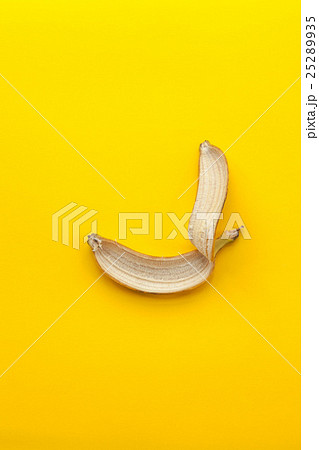 Peel banana on a yellow background Peel banana on a yellow background 25289935