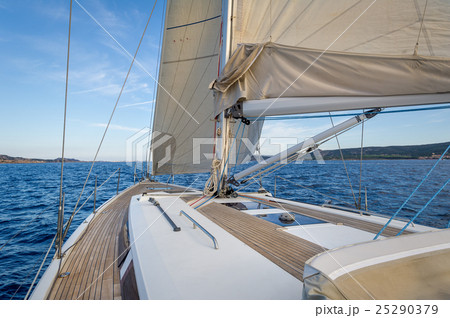 Sailing boat teak deck and hoisted sails, view Sailing boat teak deck and hoisted sails, view 25290379