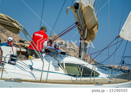 Skipper is working on his sailing boat during the Skipper is working on his sailing boat during the 25290505