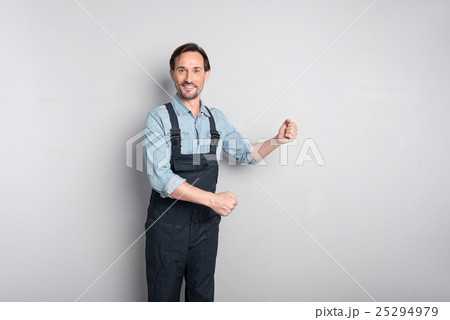 Pleasant delighted worker smiling Pleasant delighted worker smiling 25294979