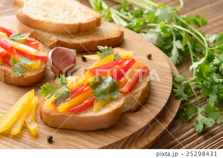 Fresh and tasty bruschetta with pepper, coriander 25298431