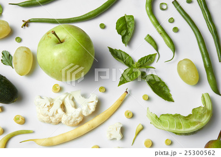 Green vegetables and fruits isolated on white. 25300562