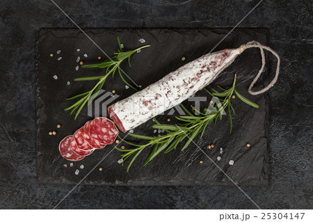 Salami on dark background 25304147