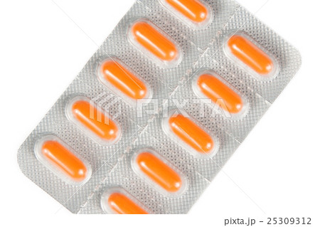 top of view of orange pills packed in blister isolated 25309312
