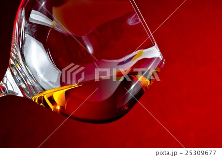 snifter of brandy in elegant glass with space for text 25309677