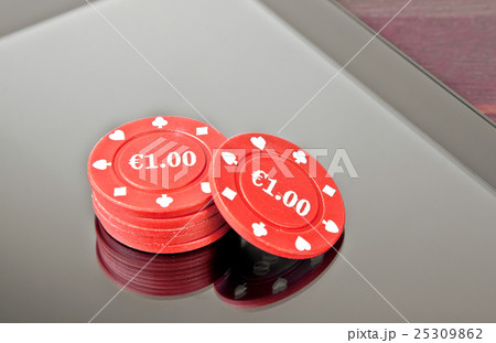 gambling chips on digital tablet pc, concept of texas game onlin 25309862