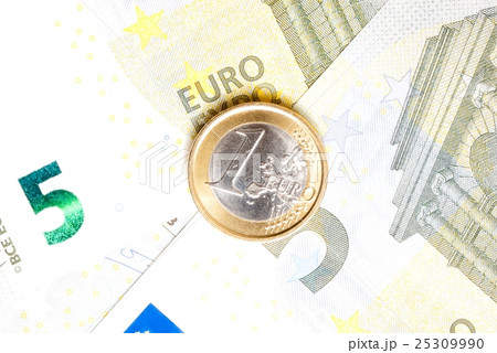 money euro coin on banknotes 25309990