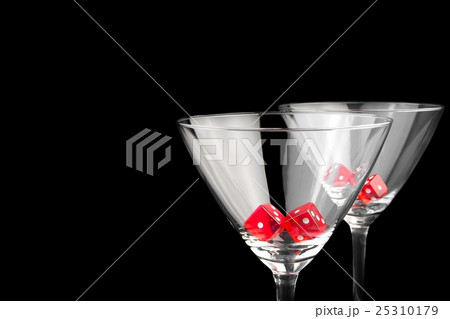 red dice in two cocktail glasses red dice in two cocktail glasses 25310179