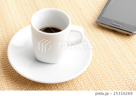 cup of coffee with smartphone cup of coffee with smartphone 25310269