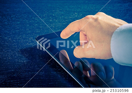 businessman touching digital tablet pc in the office businessman touching digital tablet pc in the office 25310596