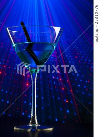blue cocktail drink in a disco with space for text blue cocktail drink in a disco with space for text 25310776