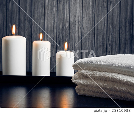 Spa massage border background with towel stacked and candles 25310988