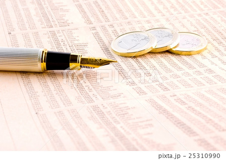euro coins and a golden pen on the financial newspaper 25310990