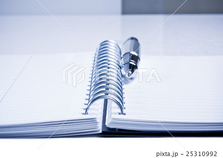 notebook and business pen on table in office 25310992