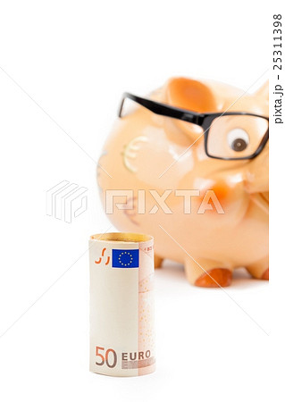 fifty euro banknote in front of unfocused piggy bank with glasses, concept for business and save money 25311398