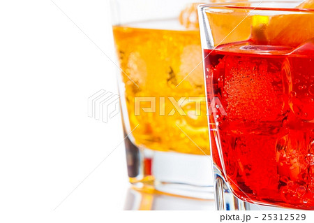 red and yellow cocktail with orange slice isolated on white background 25312529