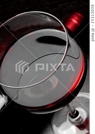 top of view of red wine glass near bottle top of view of red wine glass near bottle 25313039
