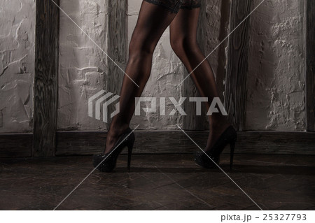 Beautiful woman legs in stockings on high heels Beautiful woman legs in stockings on high heels 25327793