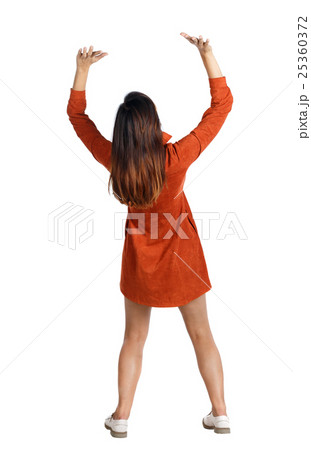 back view of woman pushes wall. Isolated over 25360372