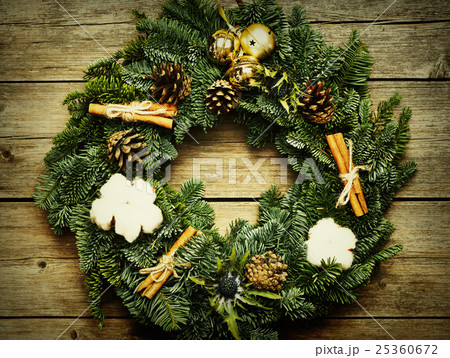 Christmas wreath on the wooden background 25360672