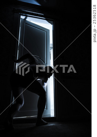 Young adult man peeping through the door 25362518