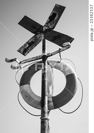 Old rusted cross shaped navigation sign 25362537