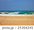 Empty ocean beach with clear sand and blue waves 25364245