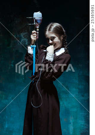 Portrait of a young girl in school uniform as a 25365691