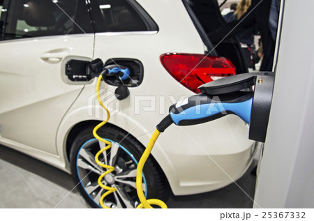 Electric car at the charging station 25367332