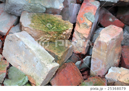 Old broken bricks covered with moss background 25368079