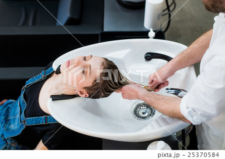 Hair care in modern spa salon. Male hairdresser 25370584