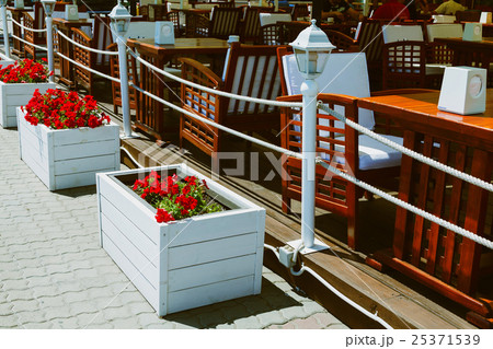 white box with flowers at the cafe on street 25371539