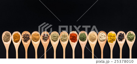Various spices in wooden spoons. Various spices in wooden spoons. 25378010