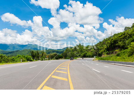 Winding Paved Road with blue sky in the mountain. Winding Paved Road with blue sky in the mountain. 25379205