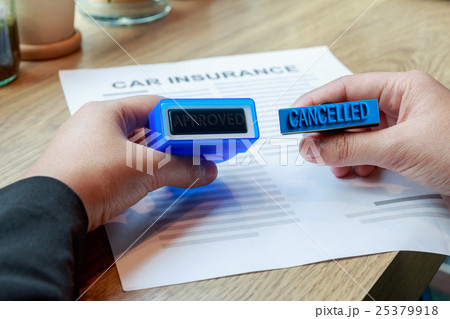 hands holding approved and cancelled rubber stamp hands holding approved and cancelled rubber stamp 25379918