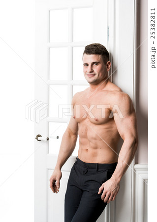 Portrait of a well built shirtless muscular male 25382811