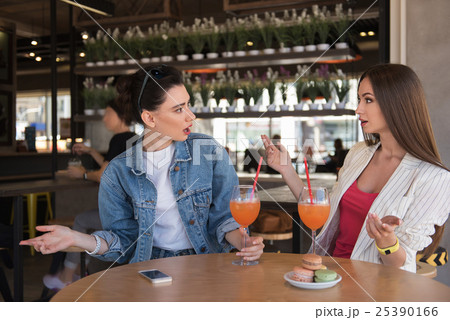 two women made a helpless gesture two women made a helpless gesture 25390166