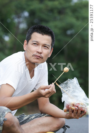 A man eating meatball A man eating meatball 25391177
