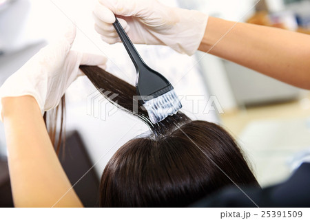 brush with dye in barber hands brush with dye in barber hands 25391509